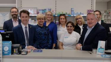 Politicians visit re- opened pharmacy damaged by fire five weeks ago